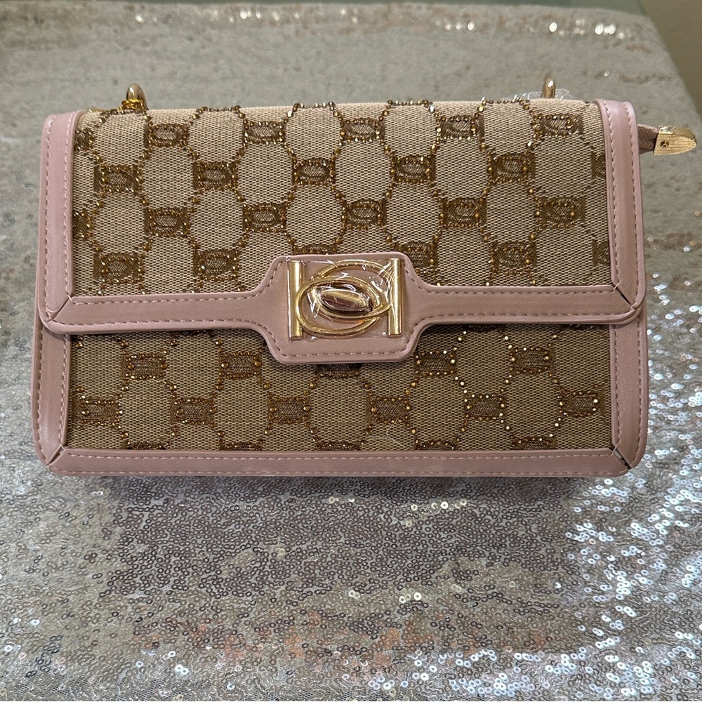 bebe Tan and Gold Wristlet with Pink Trim with chain straps